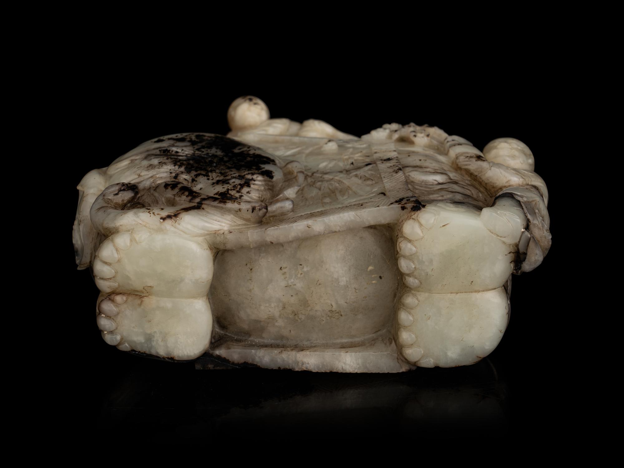 A Carved Jade ‘Elephant and Children’ Figural Group