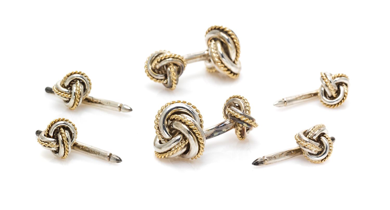 A Sterling Silver and 18 Karat Yellow Gold Knot Motif Dress Set, Tiffany & Co., 19.00 dwts.
