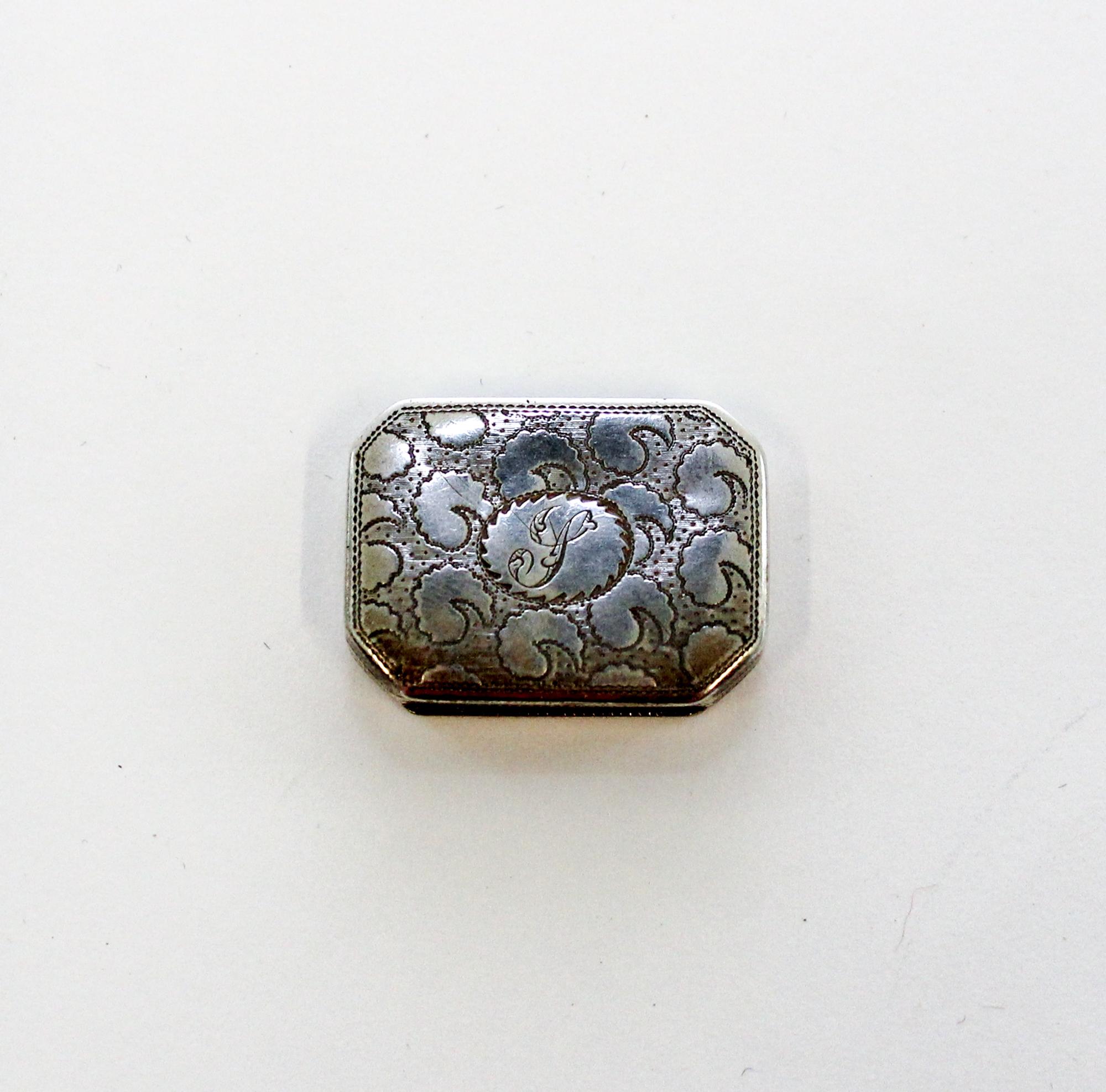 A George III Silver Vinaigrette, John Shaw, Birmingham, 1808, of rectangular form with canted corners, the lid and underside worked wit