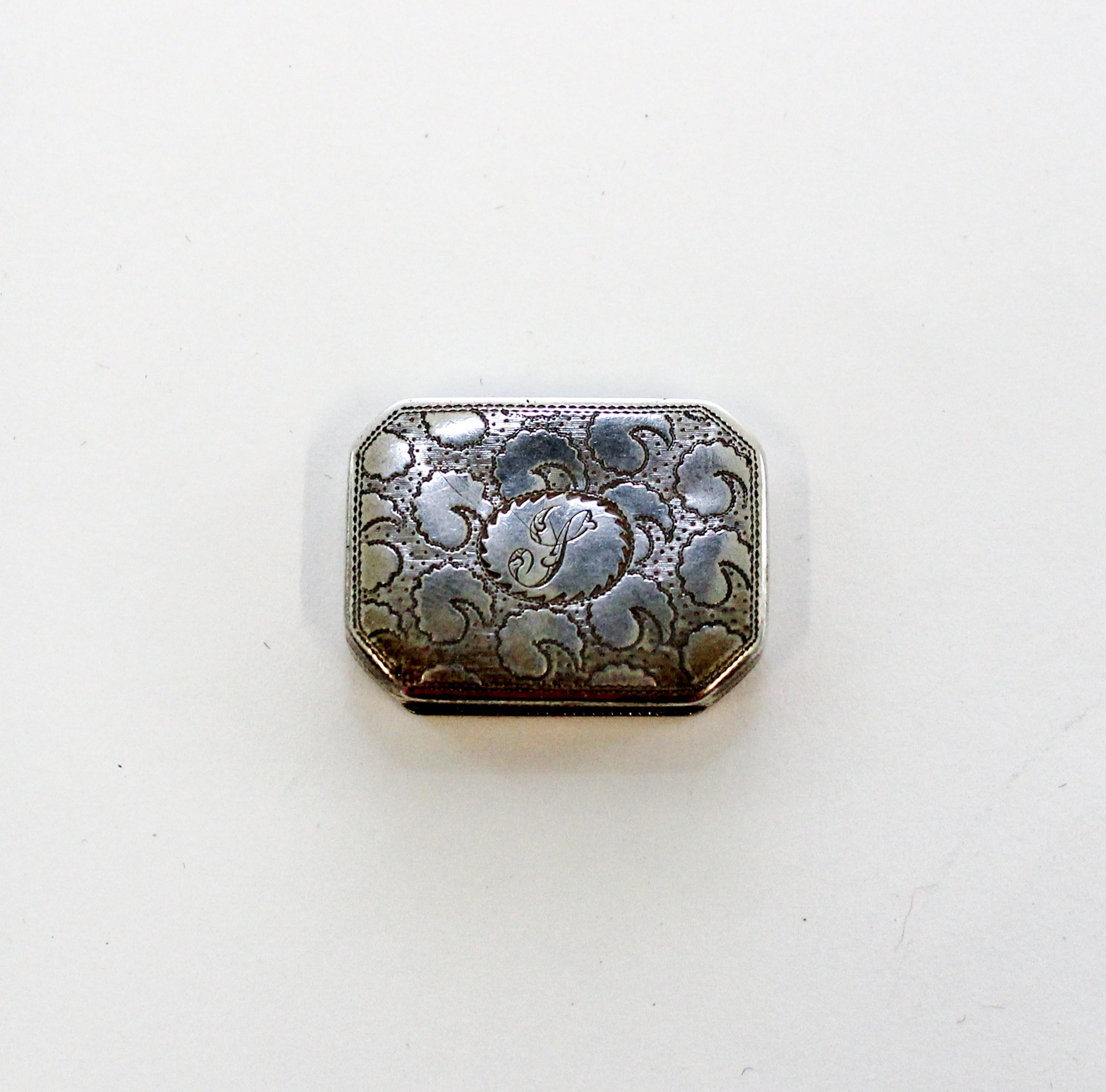 A George III Silver Vinaigrette, John Shaw, Birmingham, 1808, of rectangular form with canted corners, the lid and underside worked wit