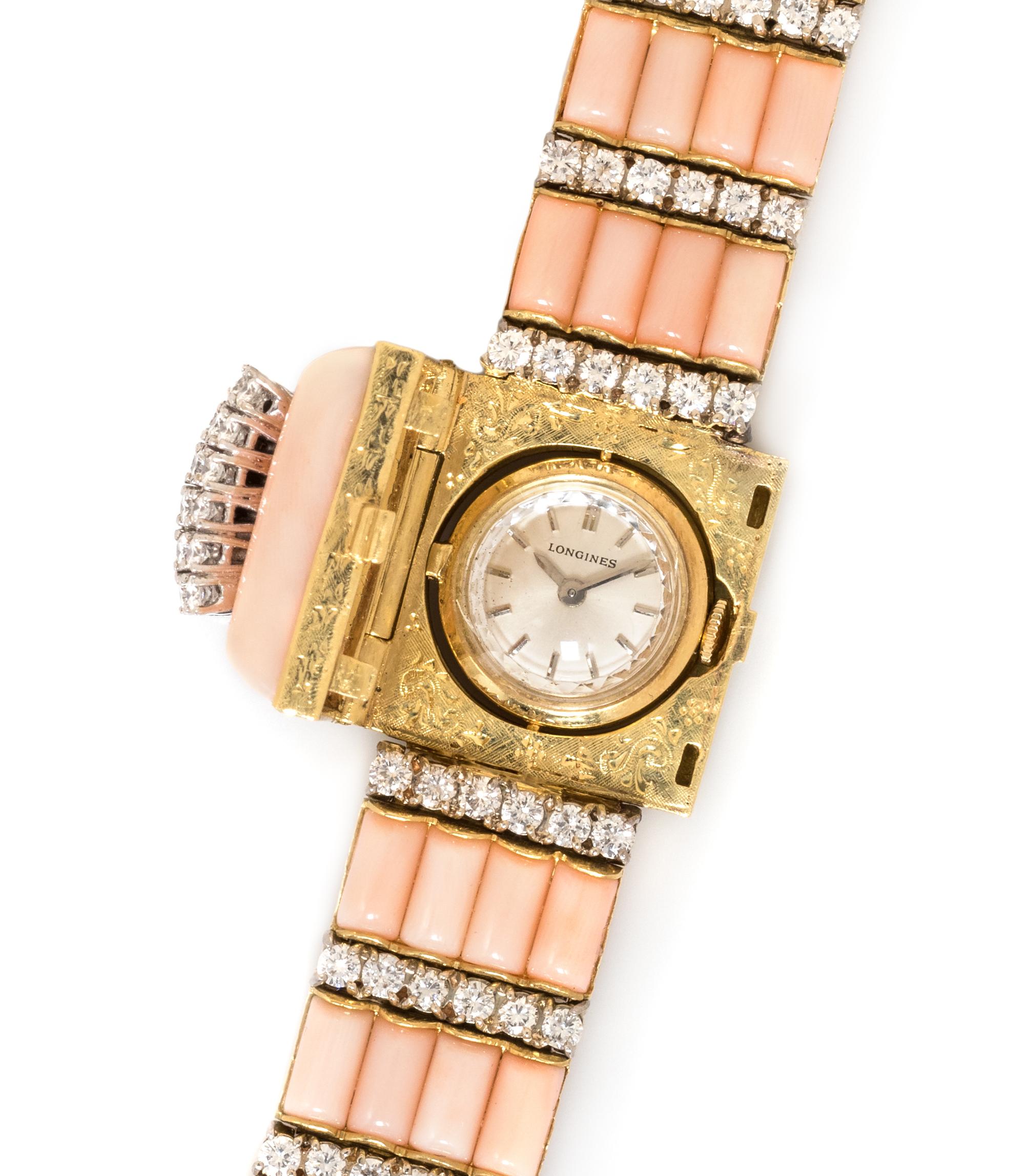 An 18 Karat Bicolor Gold, Diamond and Coral Wristwatch, Longines, 57.80 dwts.