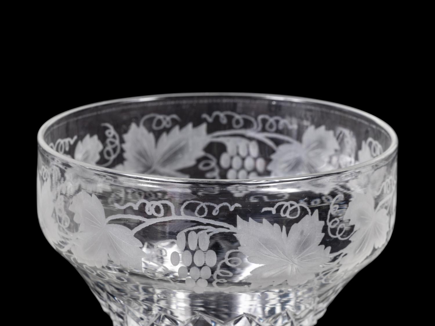 A Collection of Cut and Etched Glass Stemware and a Pitcher