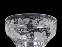 A Collection of Cut and Etched Glass Stemware and a Pitcher