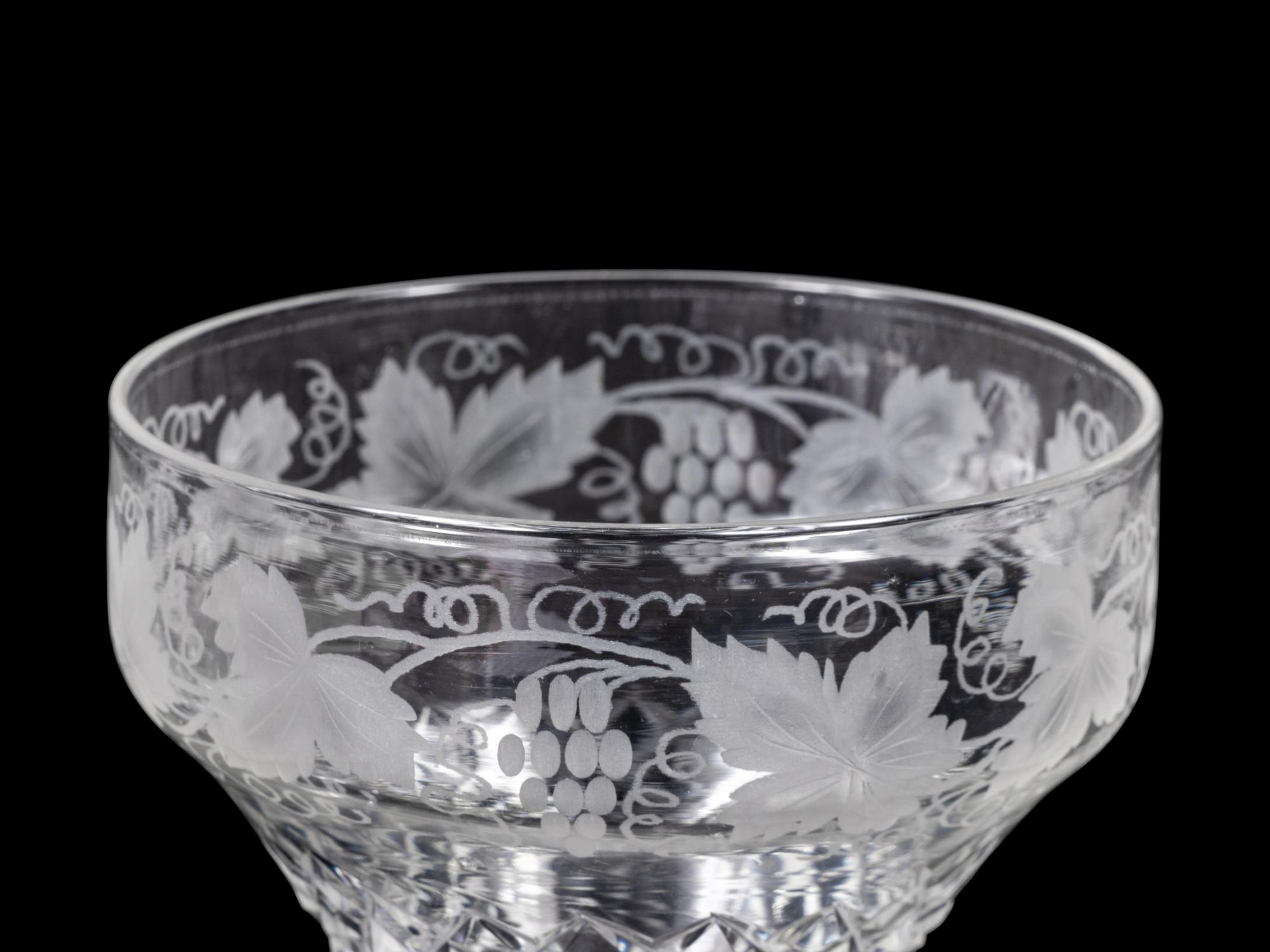 A Collection of Cut and Etched Glass Stemware and a Pitcher