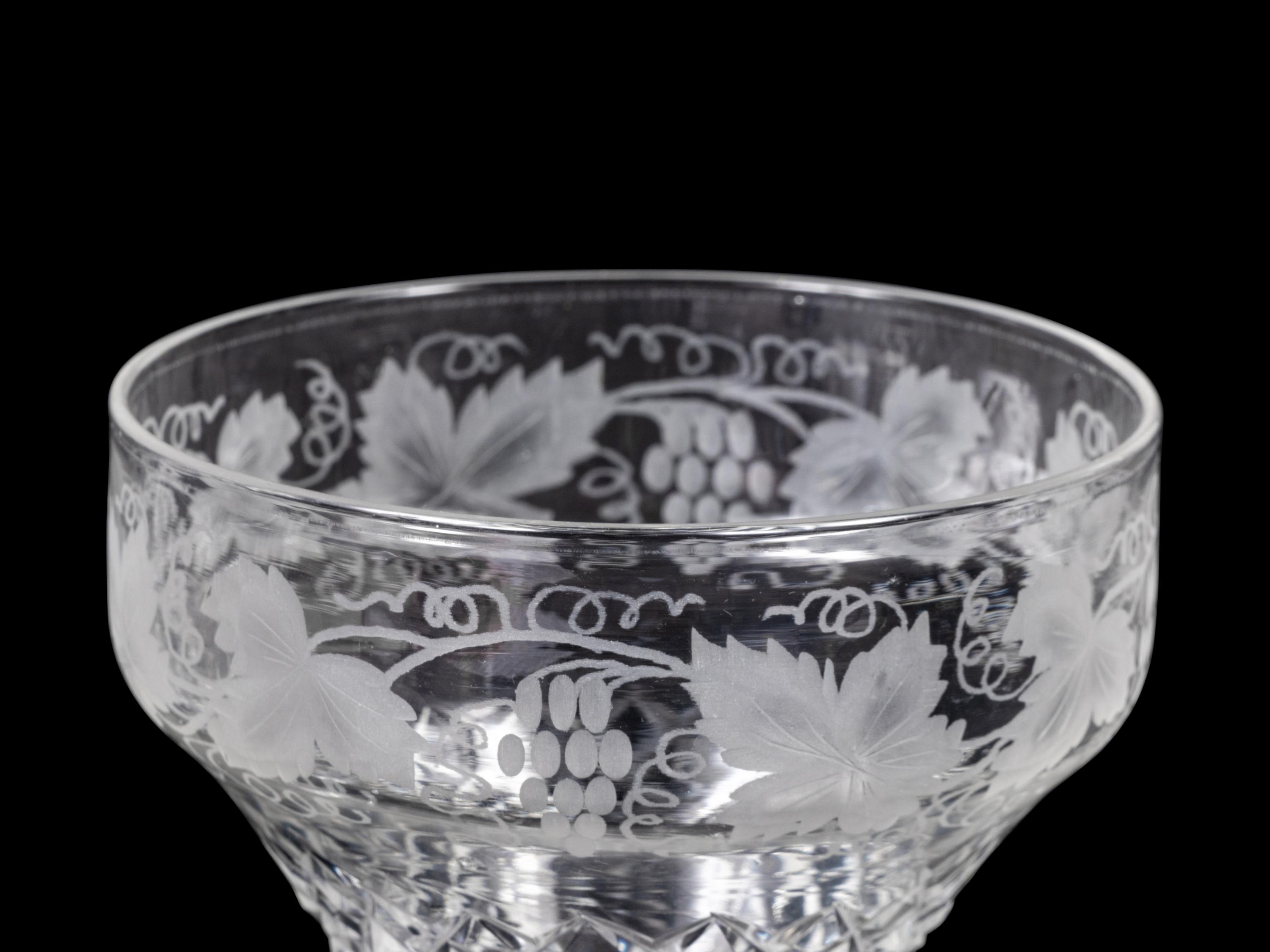 A Collection of Cut and Etched Glass Stemware and a Pitcher
