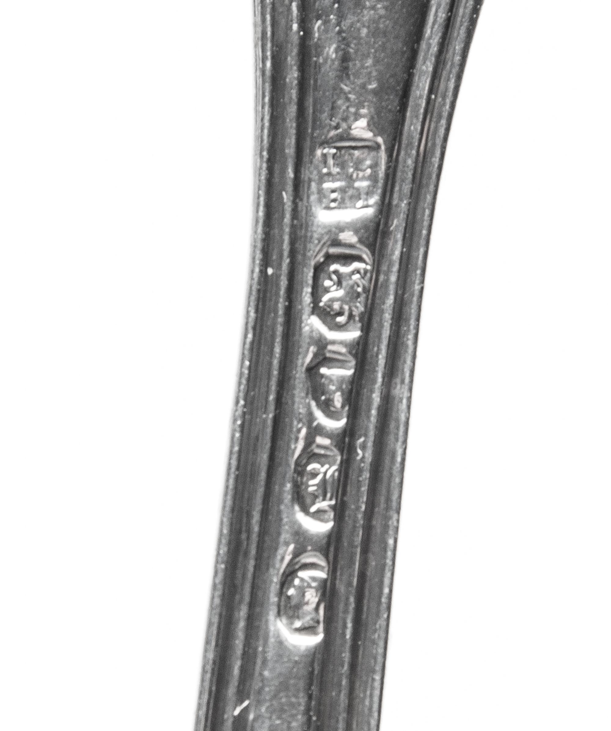 Two Victorian Silver Fish Slices, London, 1844 and 1846, comprising an example in the Victoria pattern with a star crest, William Eaton
