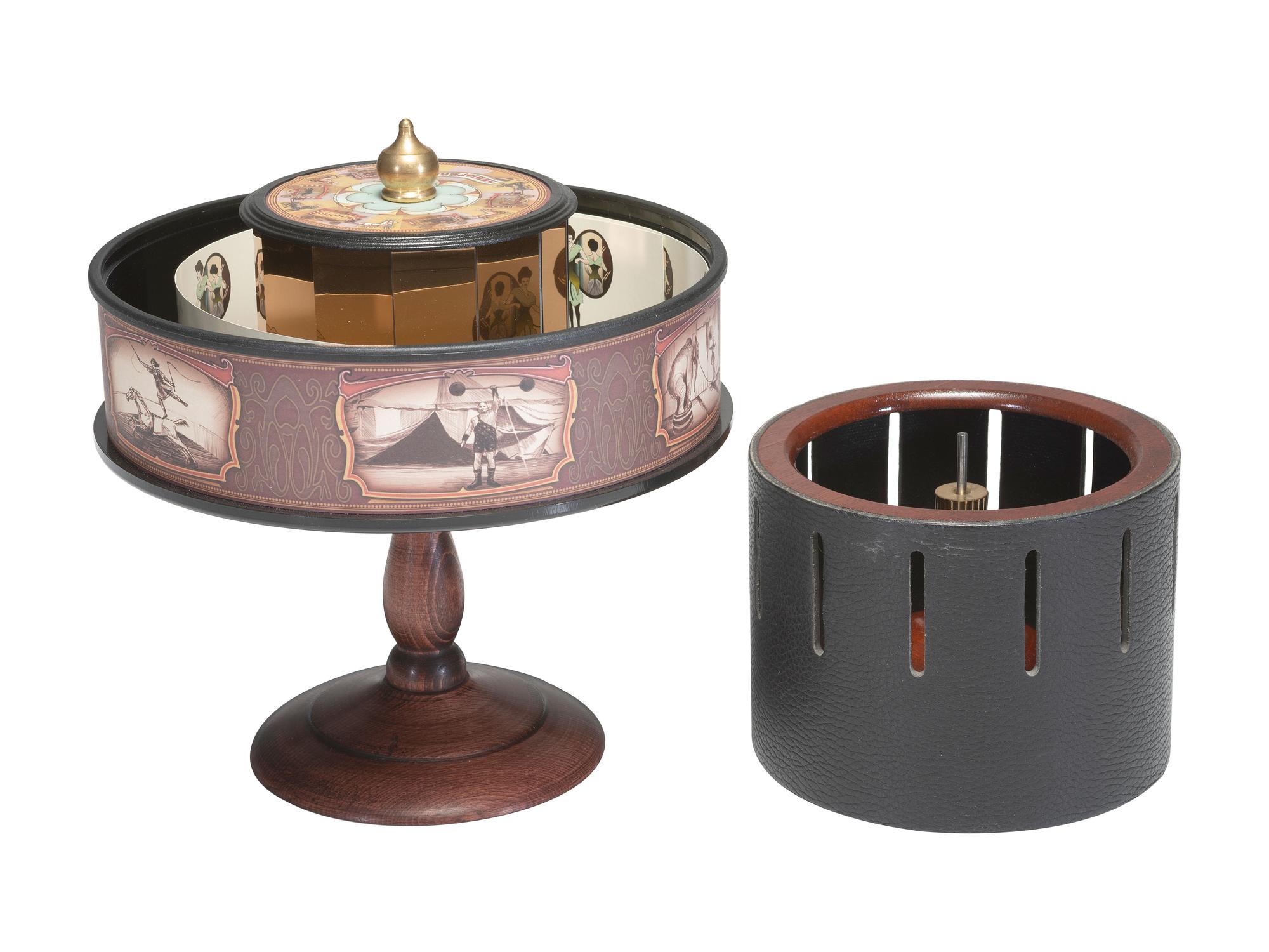 [OPTICAL DEVICES]. Replica Zoetrope and Praxinoscope with related materials.