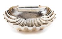 An Italian Silver Dish, Buccellati, of shell form with scalloped edges and a scrolling handle, raised on pad feet