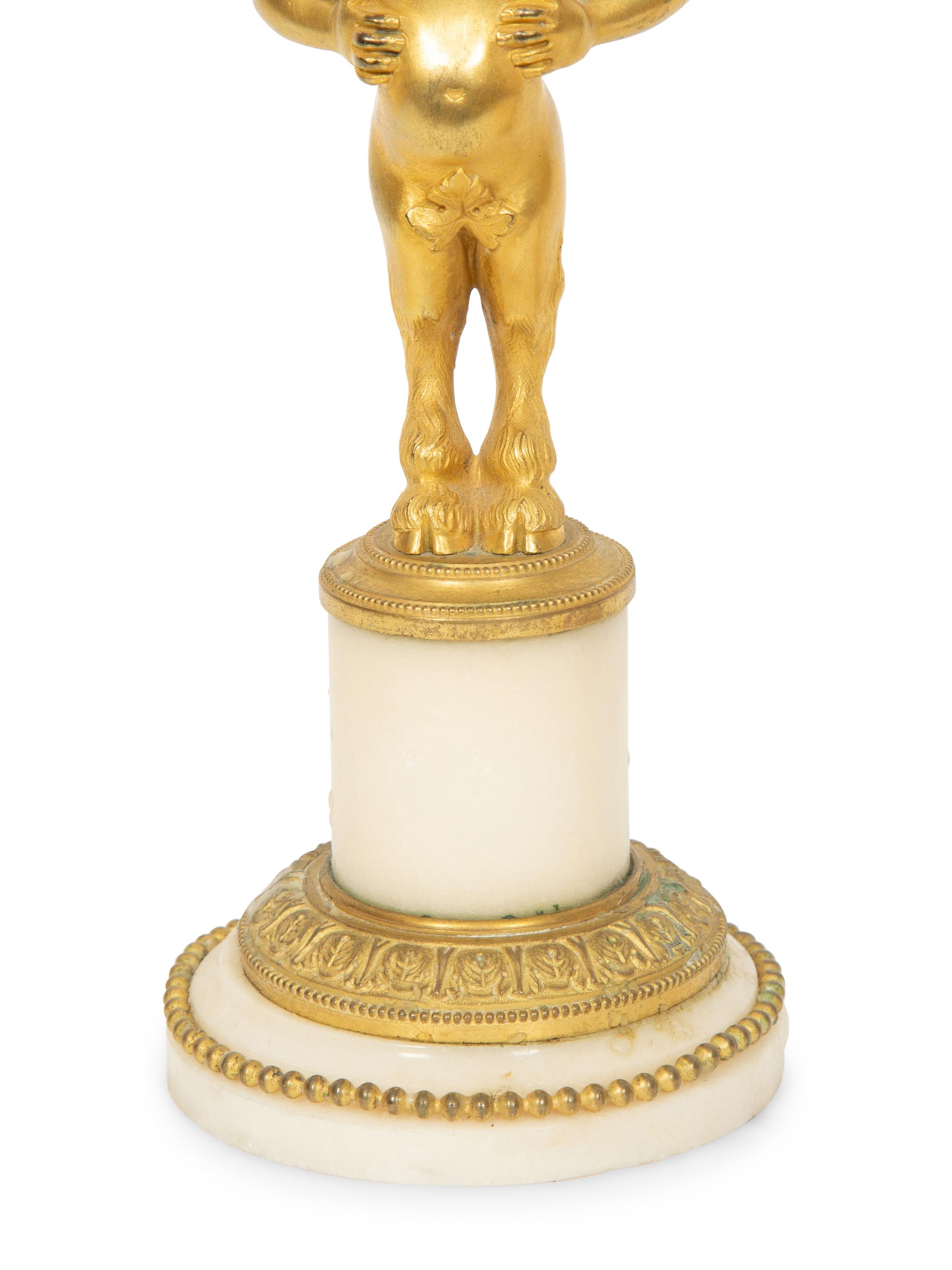 A Pair of French Gilt Bronze and Marble Figural Two-Light Candelabra