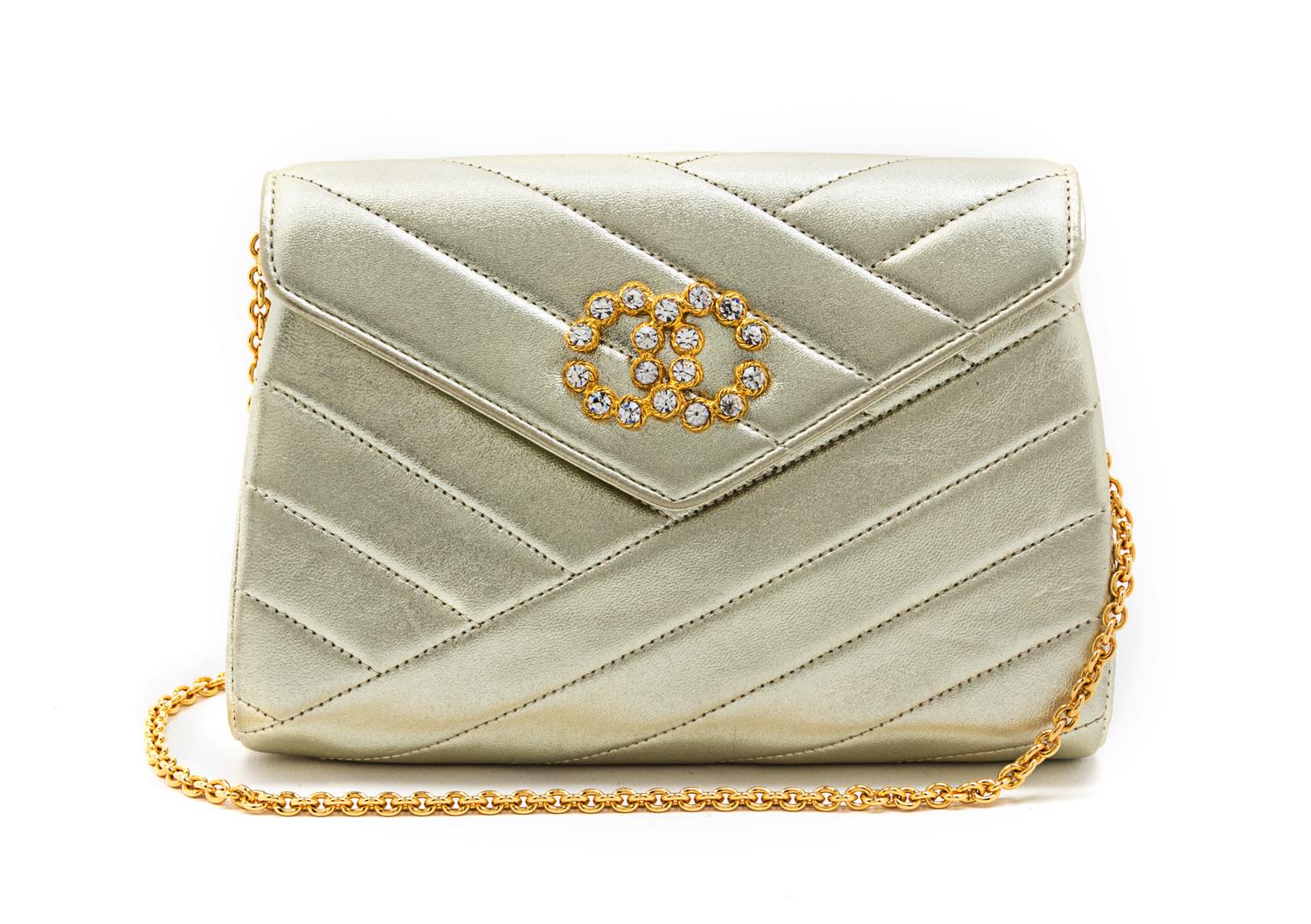A Chanel Gold Metallic Chevron Quilted Leather Flap Bag, 7 1/2 x 5 x 1 1/2 inches.