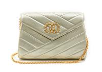A Chanel Gold Metallic Chevron Quilted Leather Flap Bag, 7 1/2 x 5 x 1 1/2 inches.