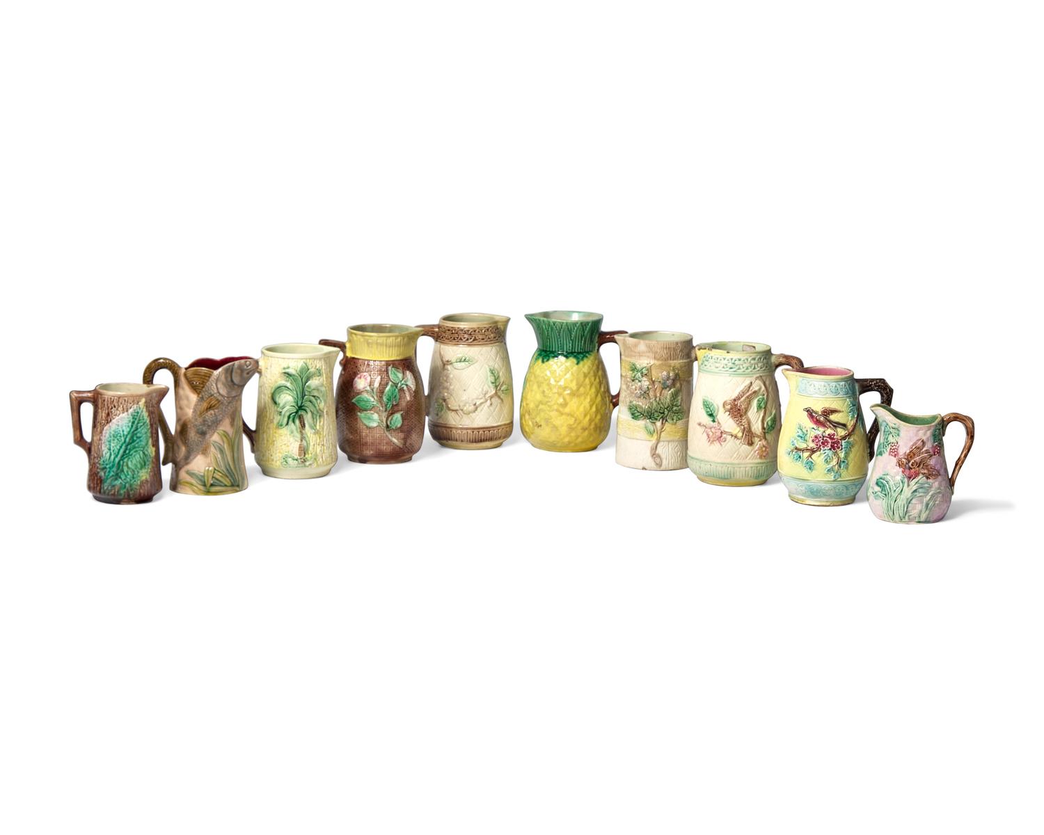 A Collection of Ten Small Majolica Pitchers