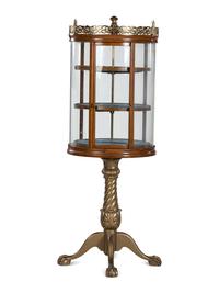 A Gilt Metal Mounted Oak Crystal Case Co. Revolving Display Case