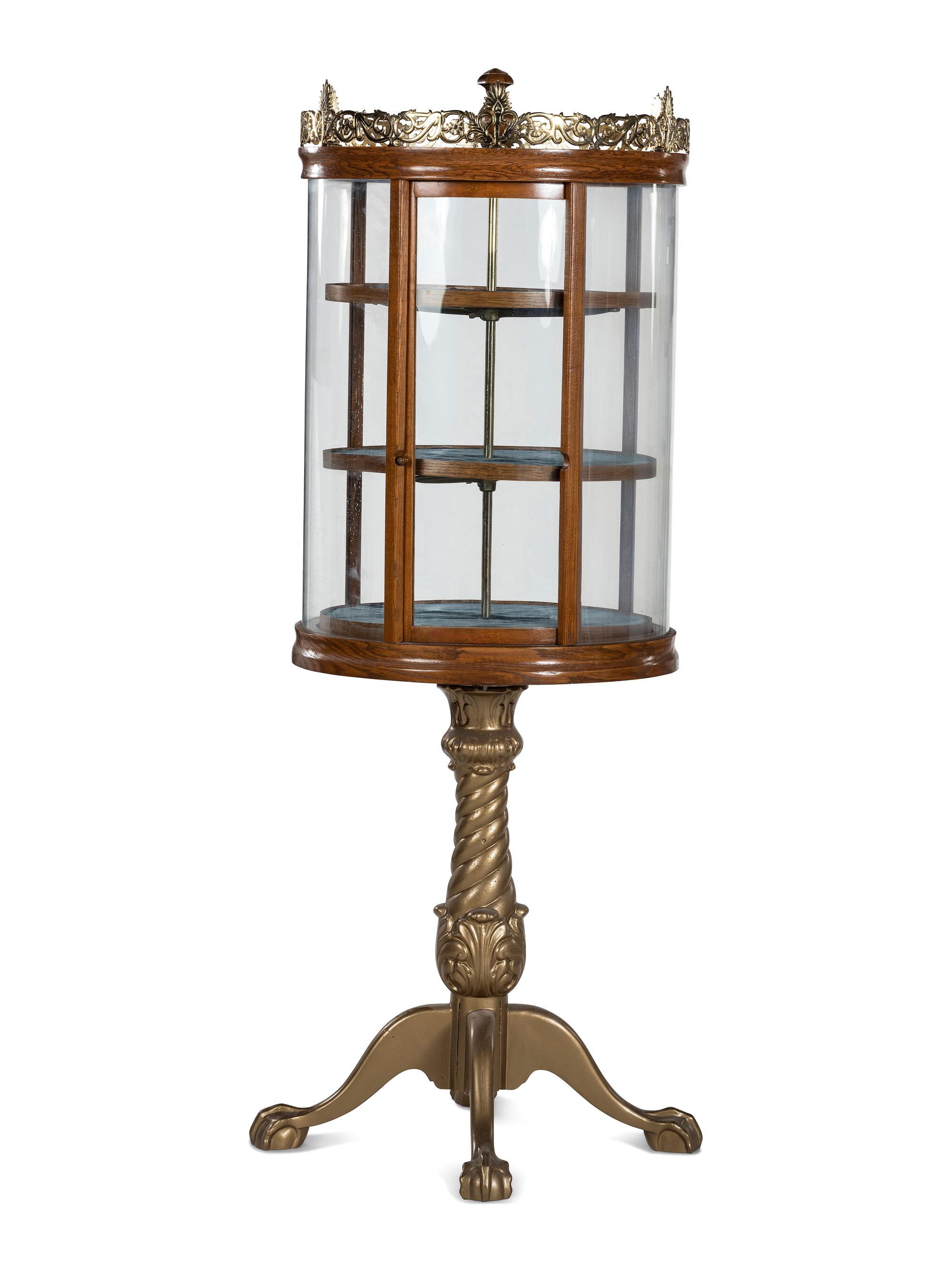 A Gilt Metal Mounted Oak Crystal Case Co. Revolving Display Case