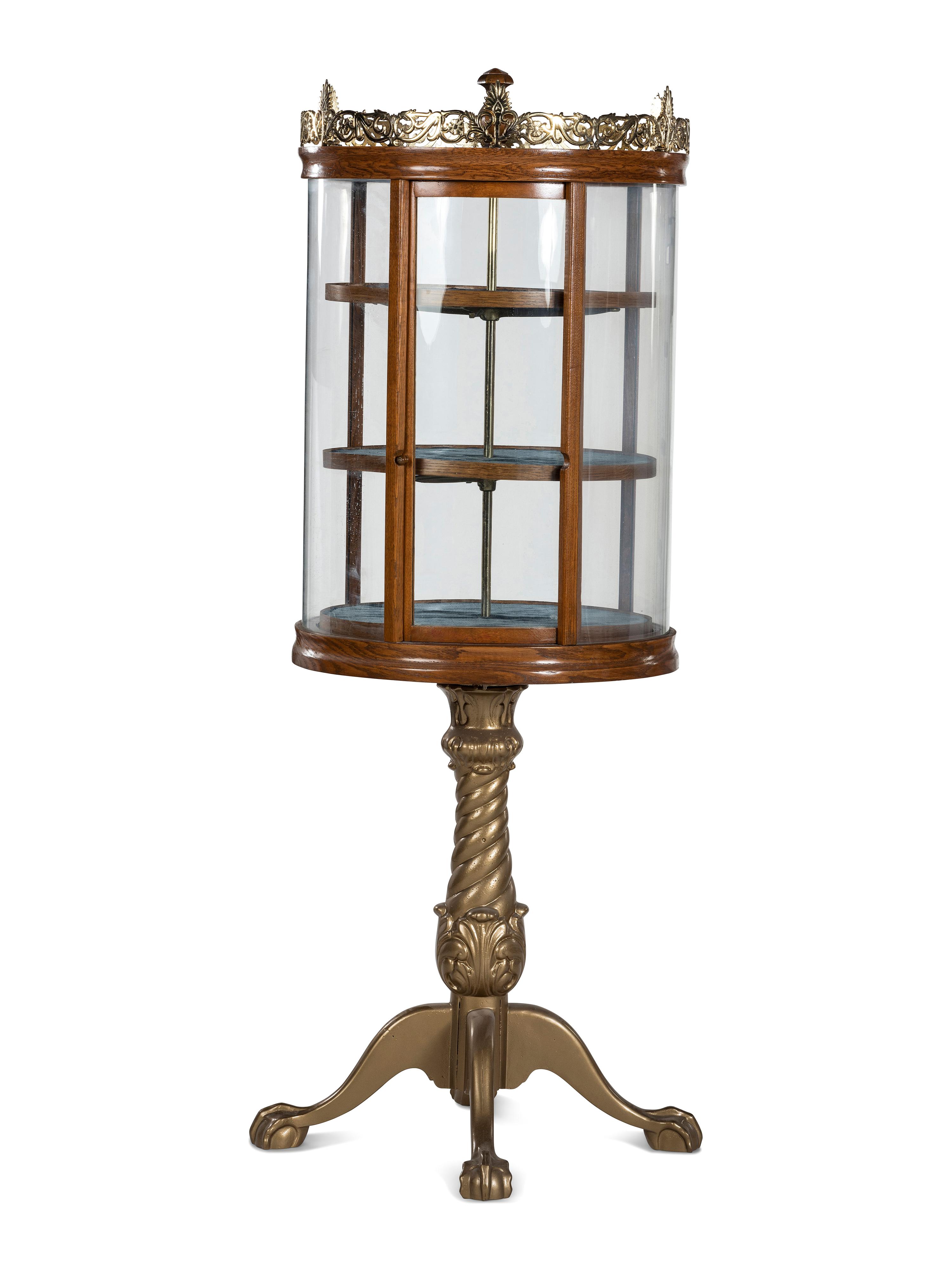 A Gilt Metal Mounted Oak Crystal Case Co. Revolving Display Case