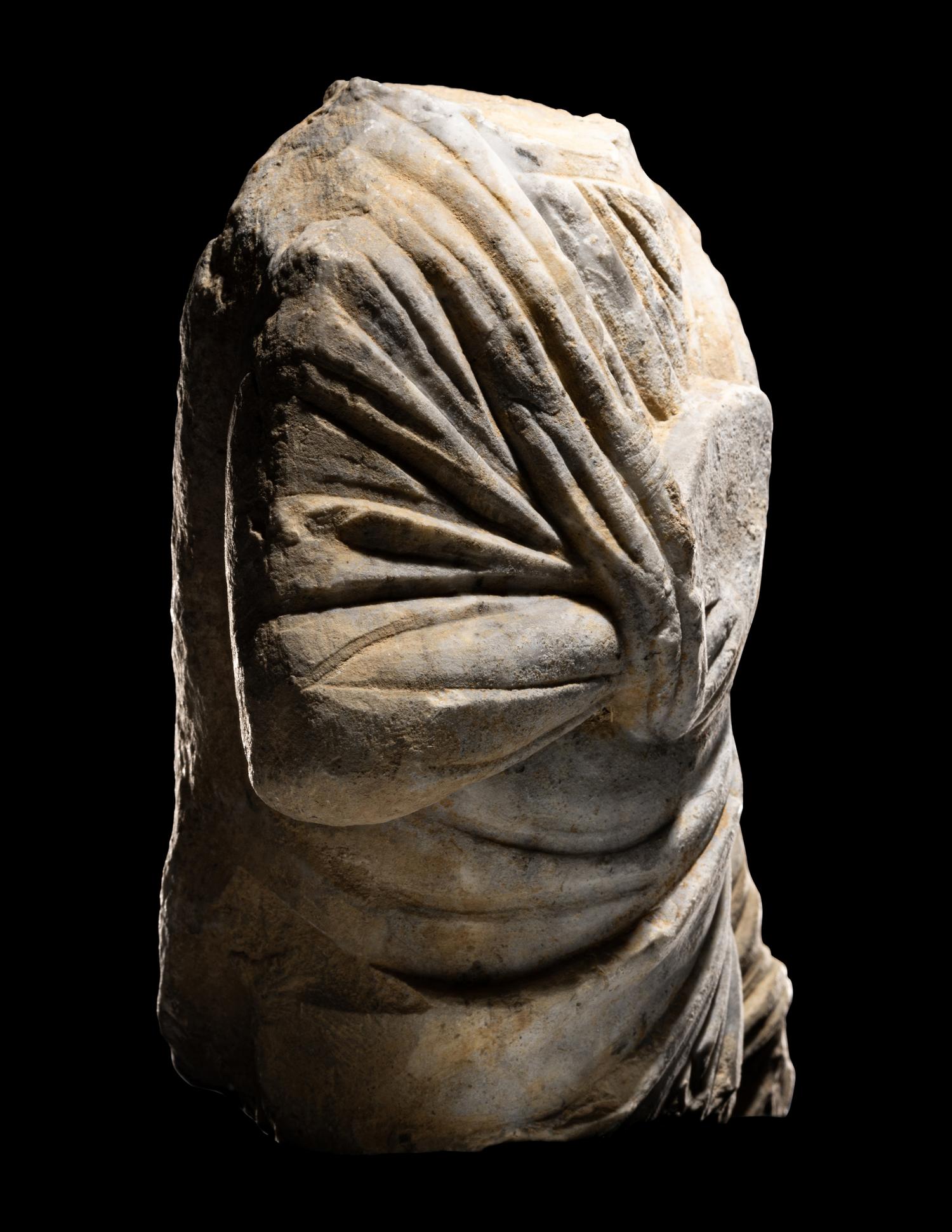 A Roman Marble Draped Torso from a Relief