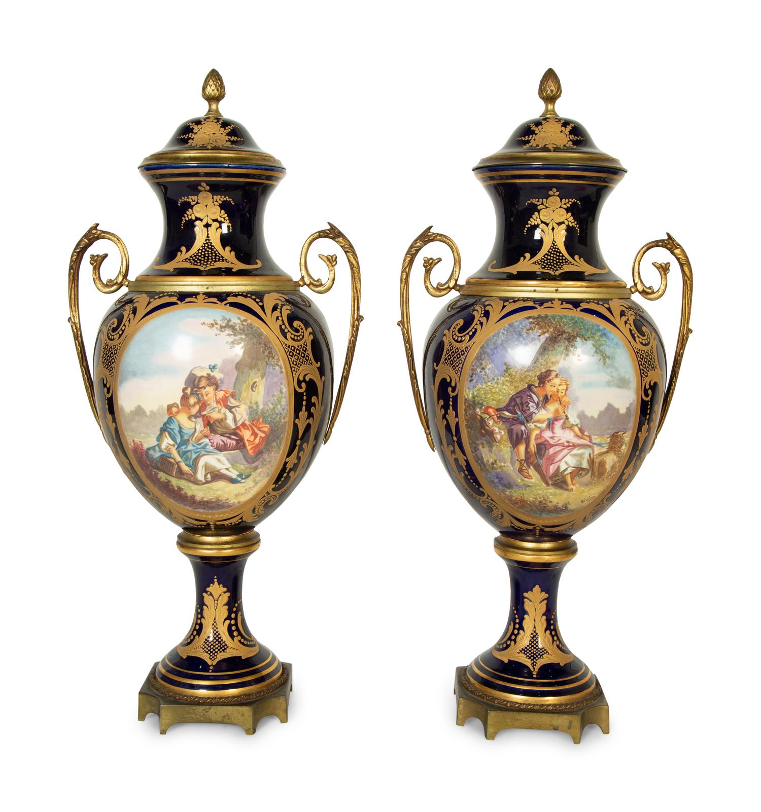 A Pair of Sèvres Style Porcelain Urns