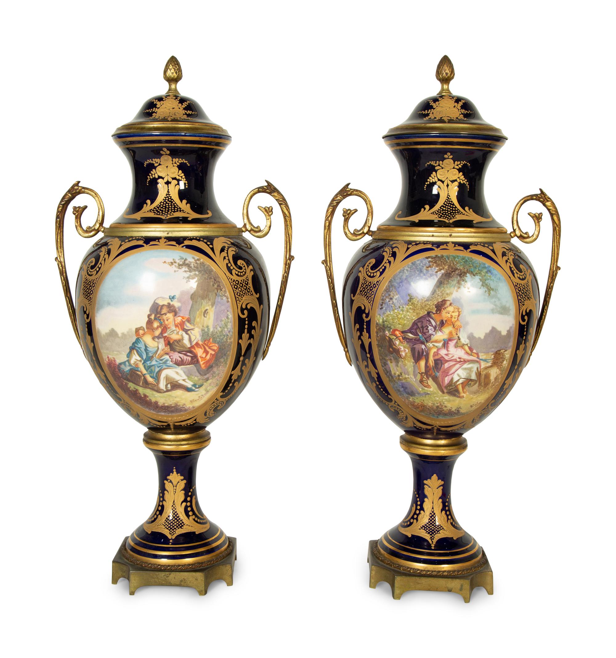 A Pair of Sèvres Style Porcelain Urns