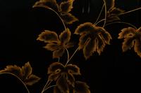A Pair of Modernist Chinese Black and Gilt Decorated Lacquered Side Tables