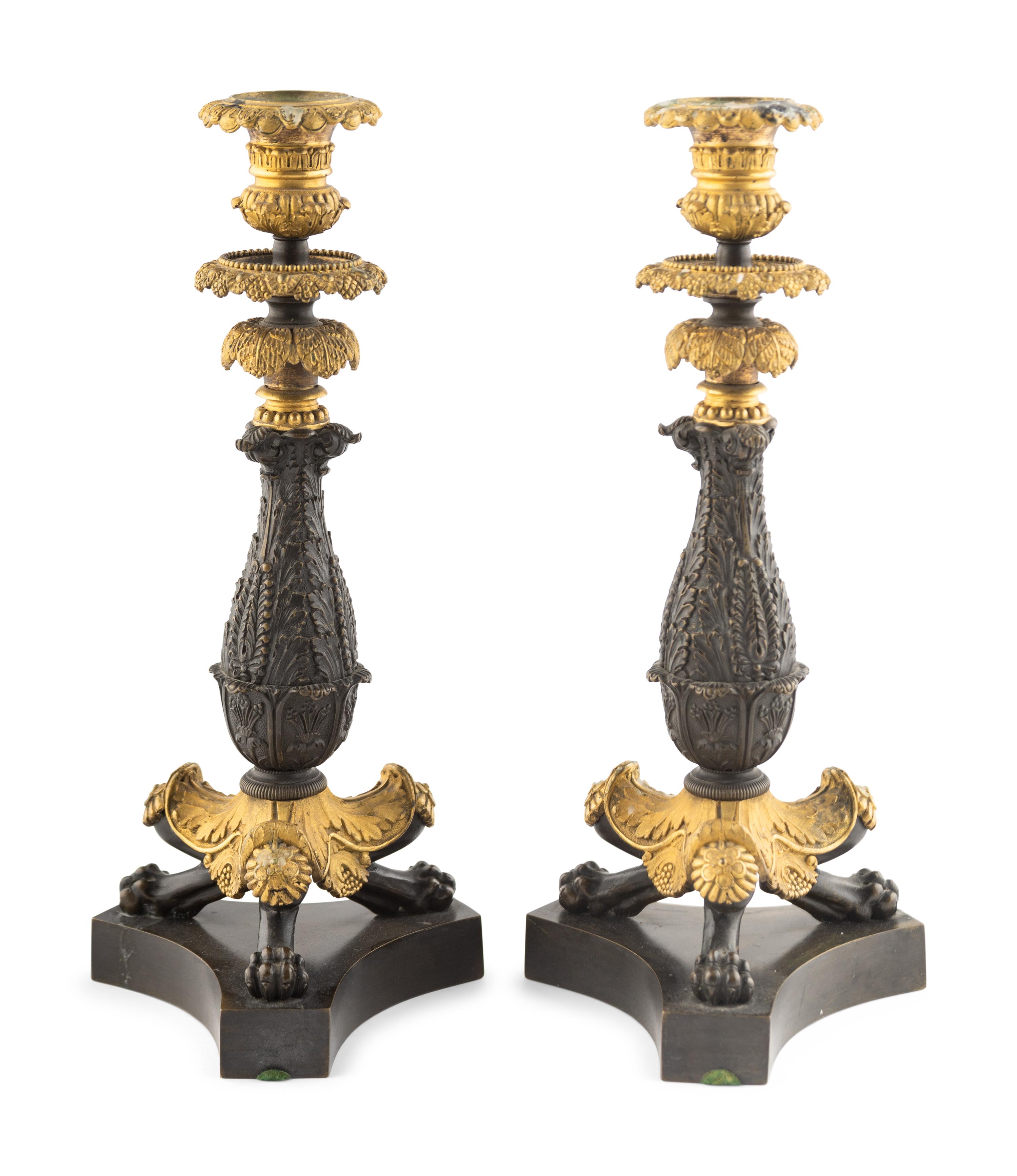 A Pair of Louis Philippe Gilt and Patinated Bronze Candlesticks