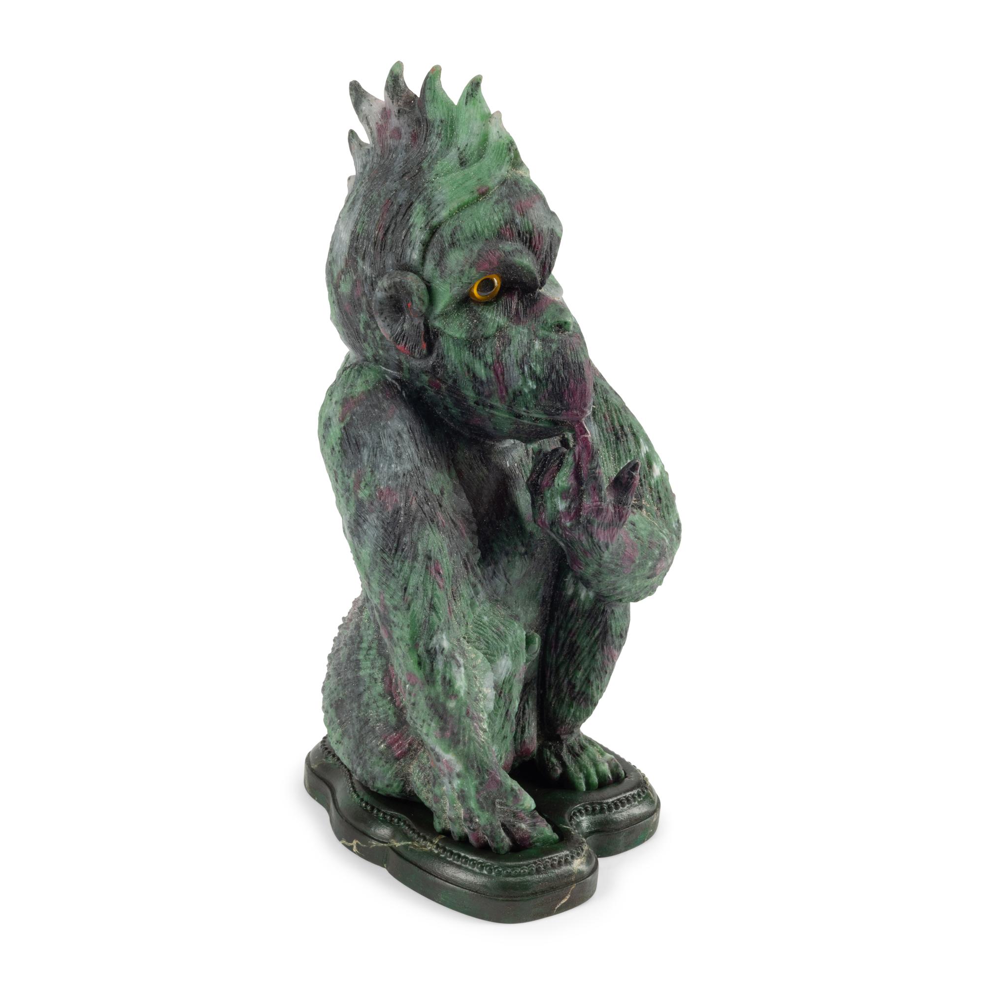 A Carved Ruby Zoisite Figure of a Seated Monkey