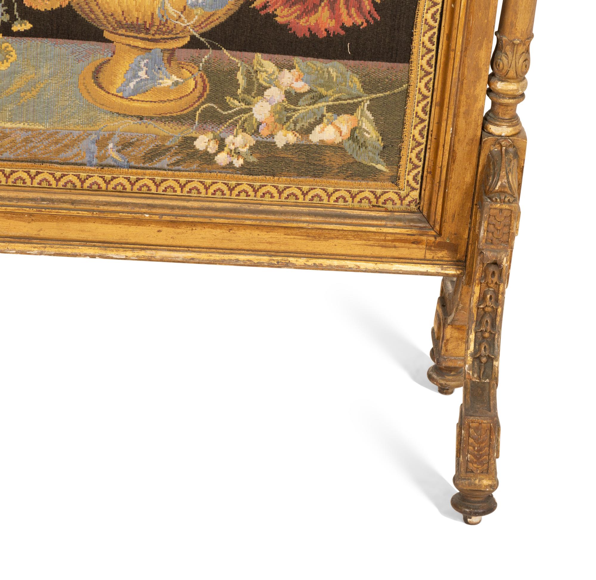 A Louis XVI Style Giltwood Fire Screen with Needlework Panel