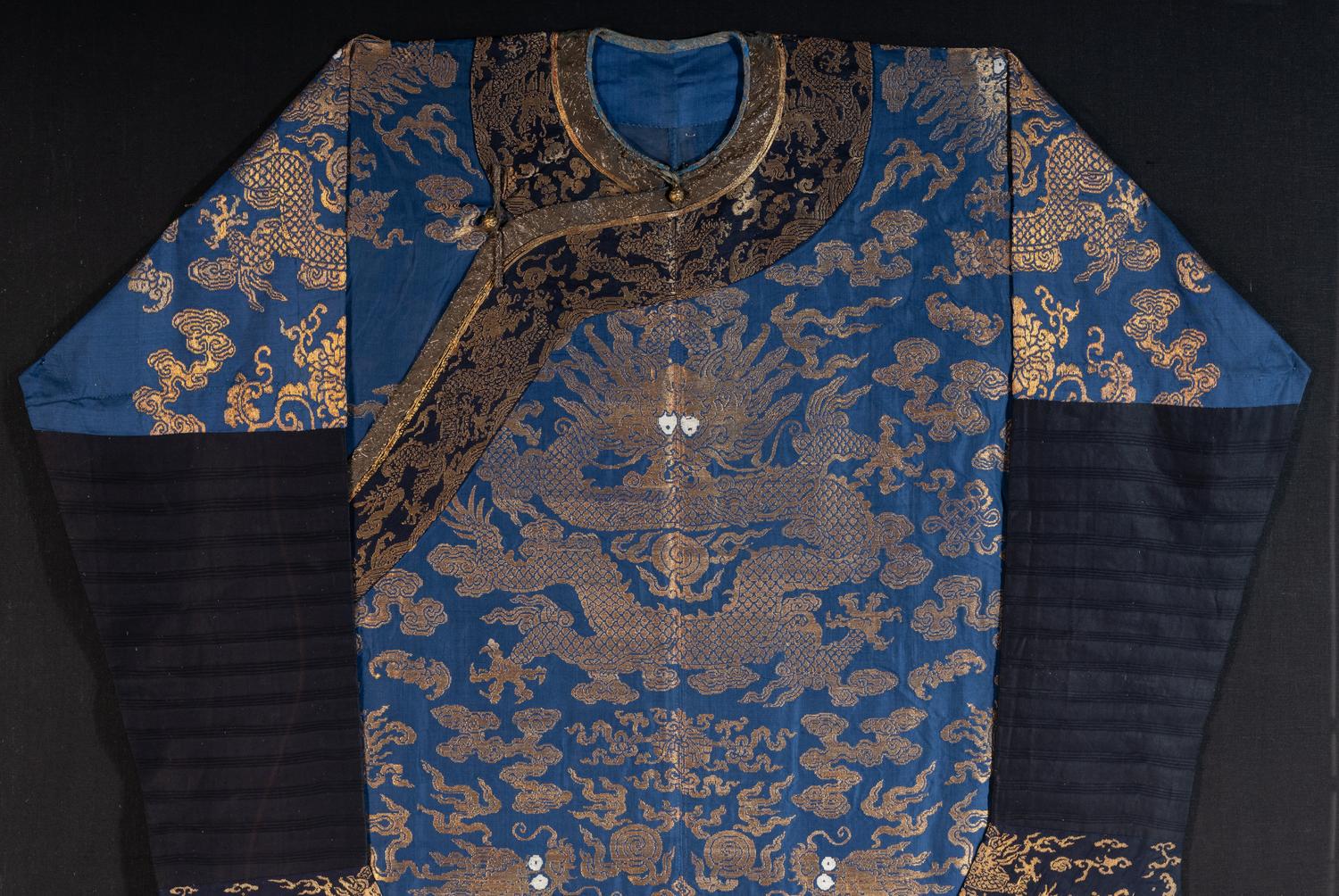 A Chinese Blue Ground Woven Dragon Robe, Jifu
