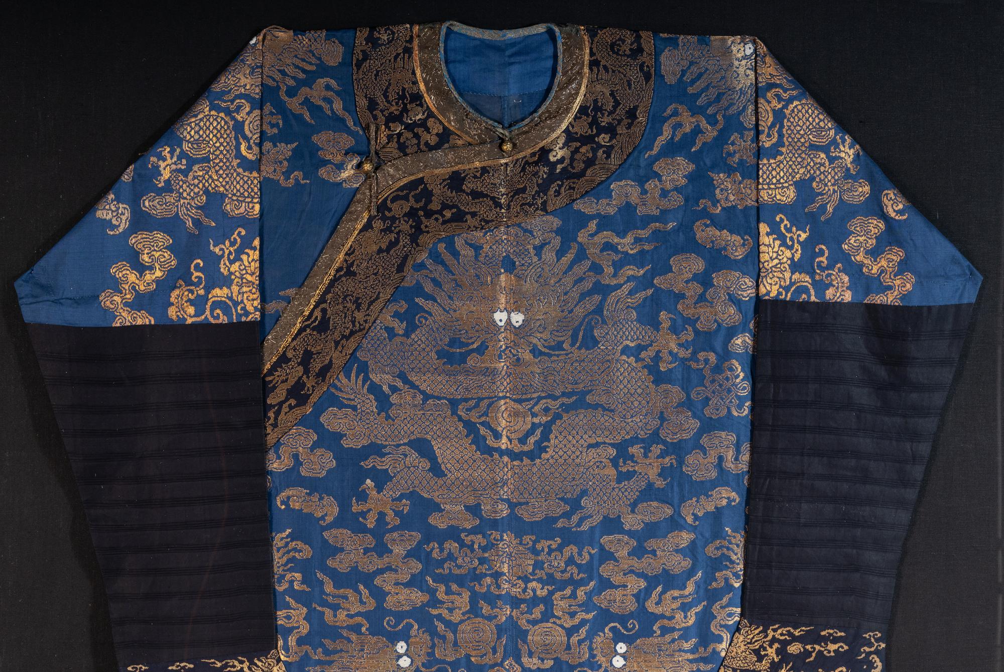 A Chinese Blue Ground Woven Dragon Robe, Jifu