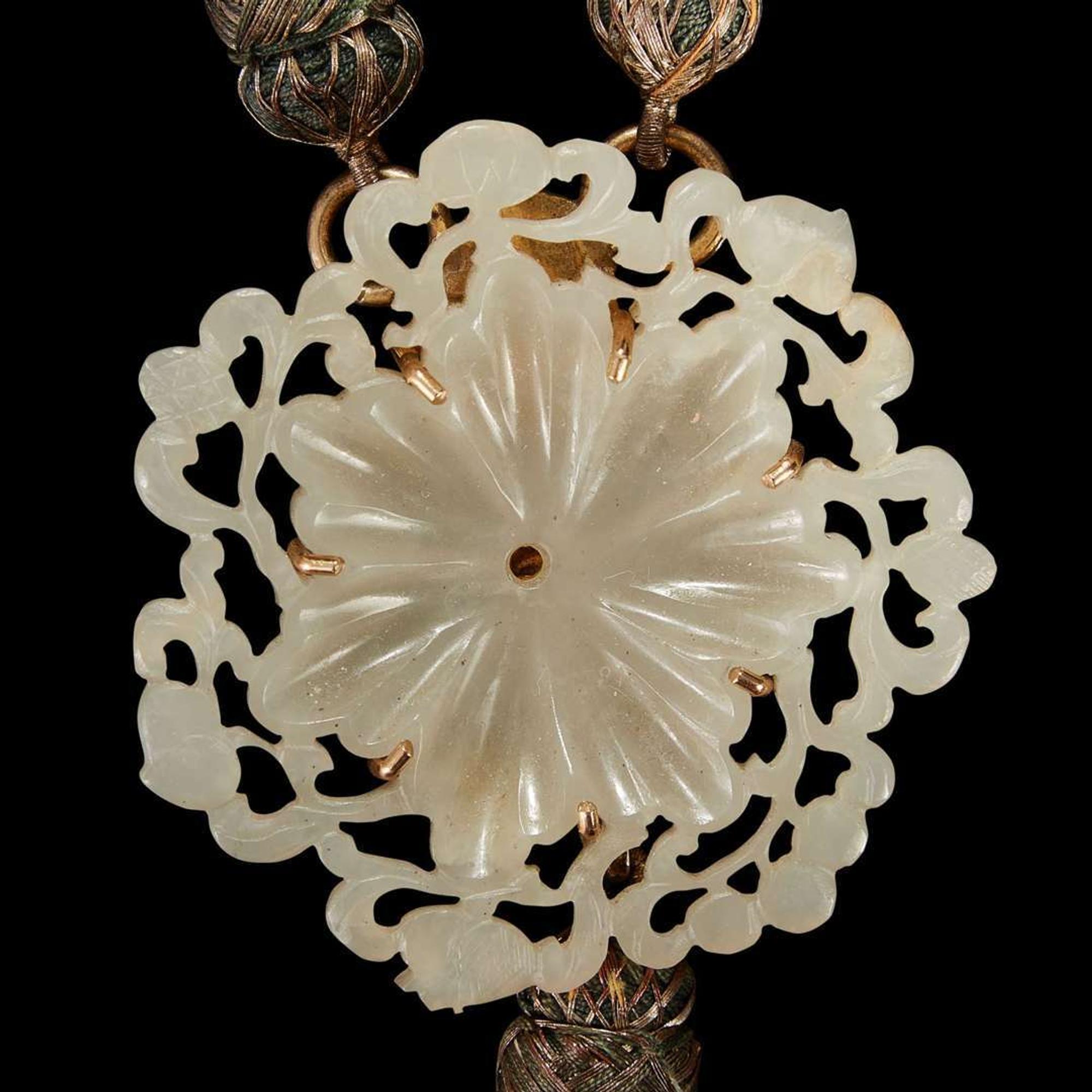 A Chinese carved reticulated greyish-white jade floraform applique The jade Qing dynasty or earlier