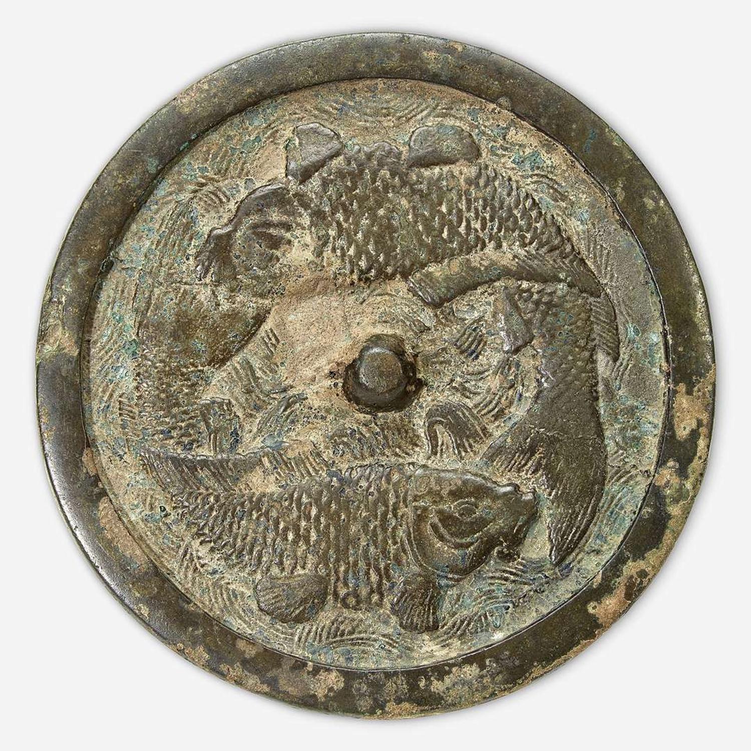 A Chinese bronze "Twin Carp" circular mirror Jin Dynasty (1115-1234)