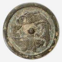 A Chinese bronze "Twin Carp" circular mirror Jin Dynasty (1115-1234)