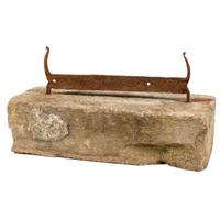 A Wrought Iron Boot Scrape with Stone Base