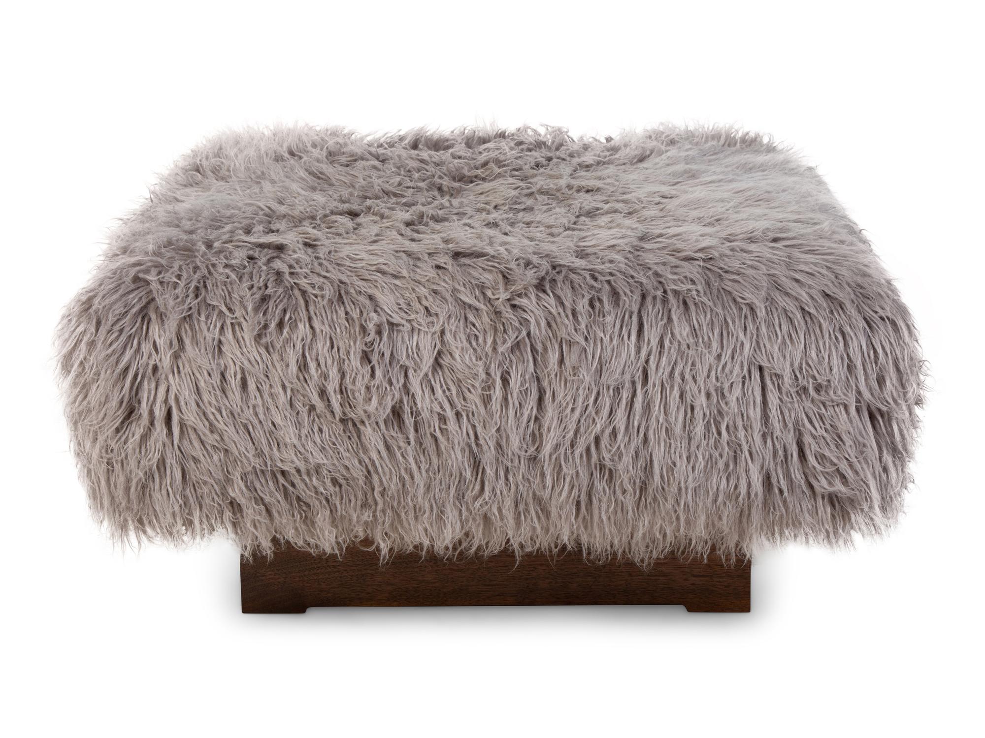 An American Sheepskin-Upholstered Ottoman — 20TH CENTURY