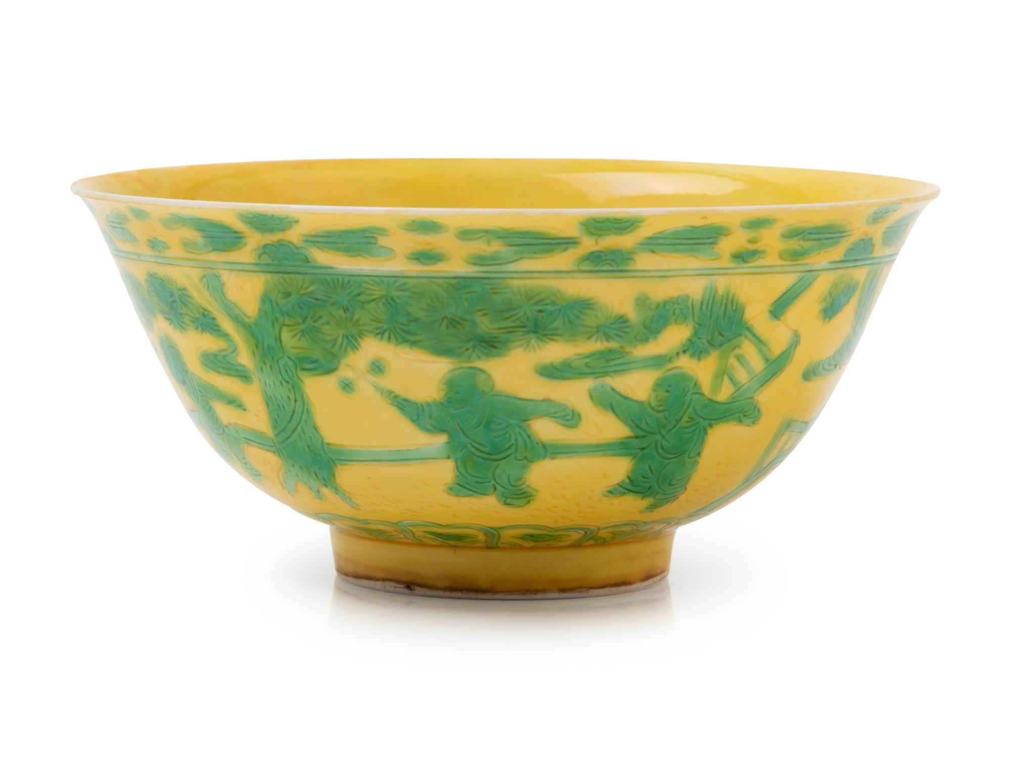 An Incised and Green Enameled Yellow Ground 'Boys' Porcelain Bowl