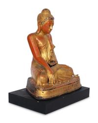 A Burmese Gilt and Red Lacquered Bronze Seated Buddha