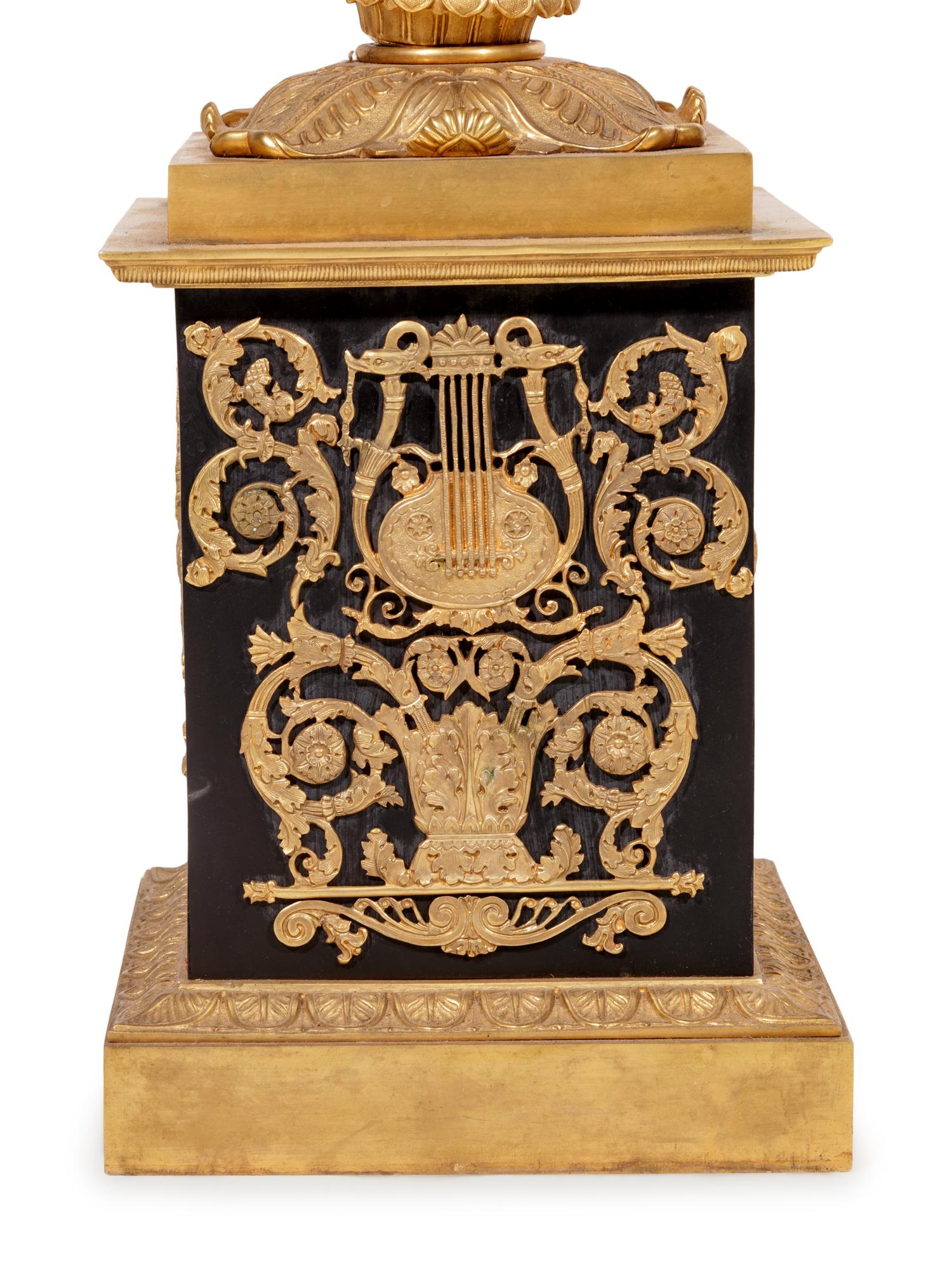 A Pair of Empire Style Gilt and Patinated Cast Metal Seven-Light Torchères