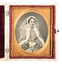 [EARLY PHOTOGRAPHY]. Striking daguerreotype portrait of a young woman wearing a veil.