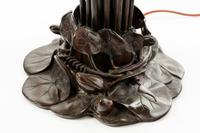A Pair of Art Nouveau Style Patinated Metal and Iridescent Glass Eighteen-Light Tulip Lamps