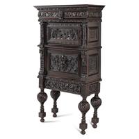 An Italian Renaissance Revival Carved Oak Bureau Cabinet on Stand