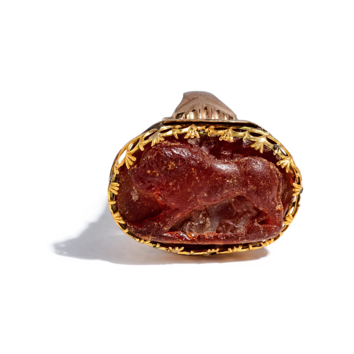A Renaissance Amber Cameo of a Striding Lion — Set in a 19th Century gold ring