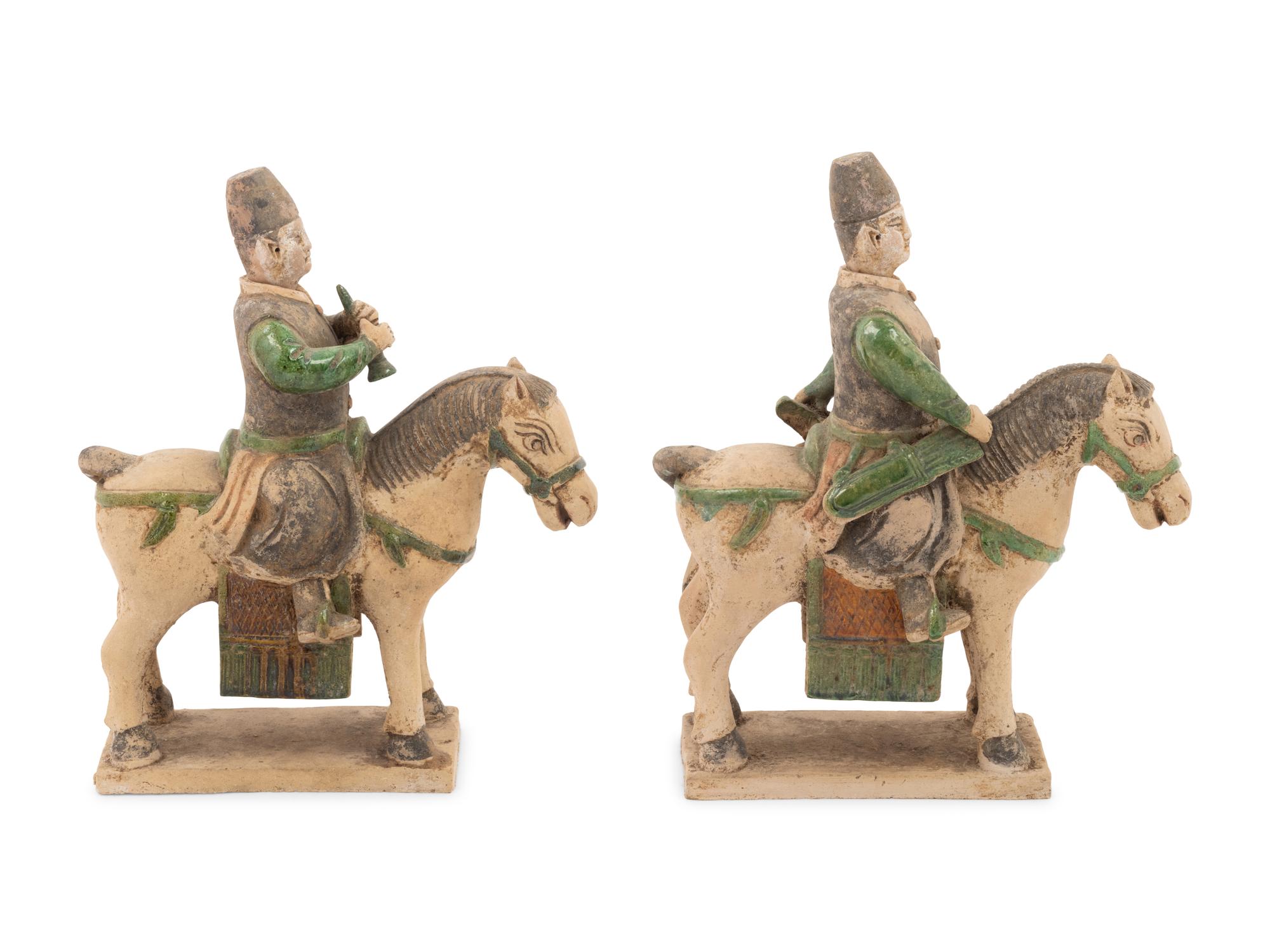 A Pair of Chinese Sancai Glazed Mounted Musician Burial Figures