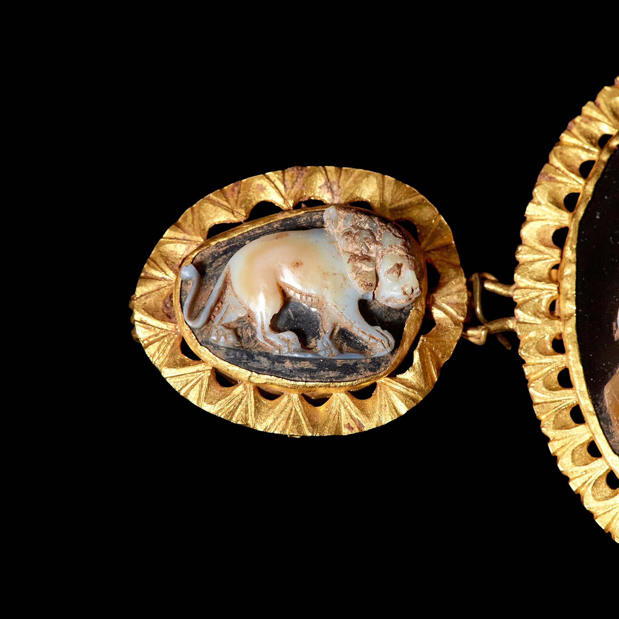 A Trio of Gold-mounted Sardonyx Cameos featuring Nero