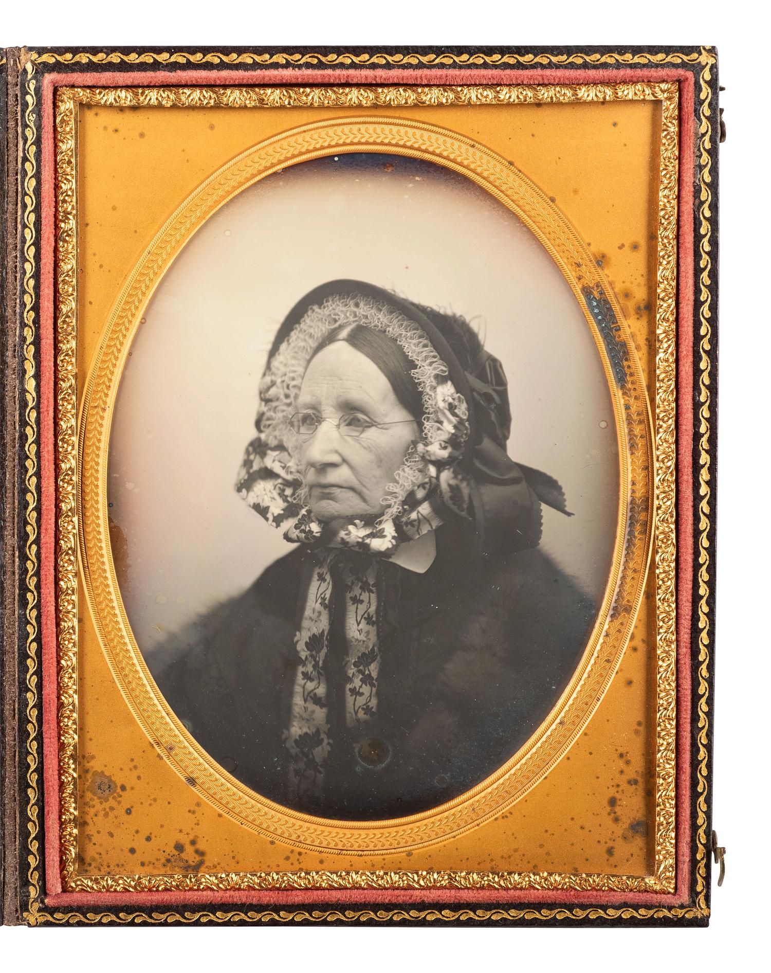 [EARLY PHOTOGRAPHY]. WARREN, George K., artist. Half plate daguerreotype of a well-dressed matron, from the personal studio collection of Warren. Lowell, MA, ca 1858-1864.