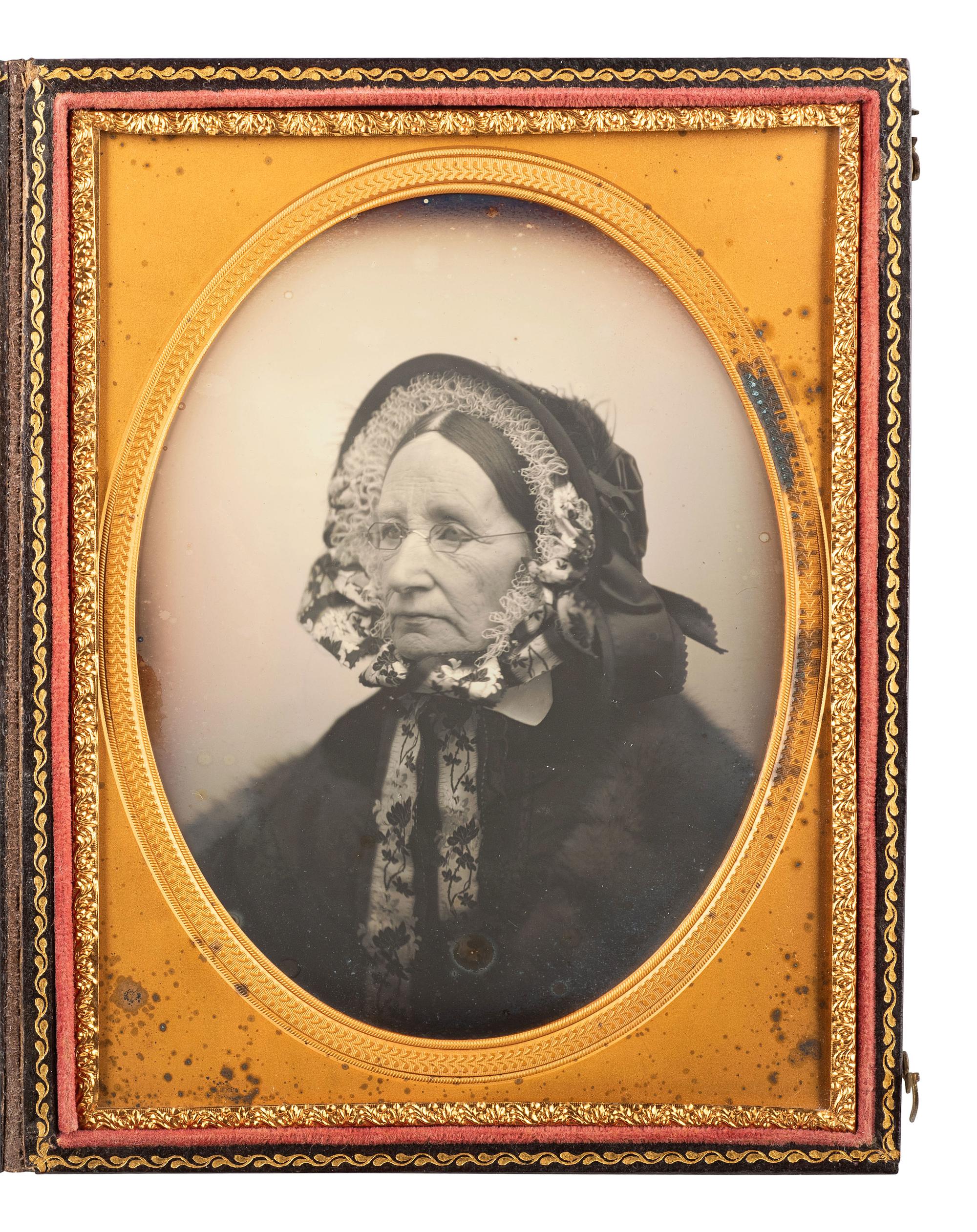 [EARLY PHOTOGRAPHY]. WARREN, George K., artist. Half plate daguerreotype of a well-dressed matron, from the personal studio collection of Warren. Lowell, MA, ca 1858-1864.