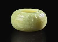 A Chinese carved greenish-yellow jade archaistic coupe Qing dynasty, 18th/19th century 倣古青黃玉水丞 清 十八或十九世紀
