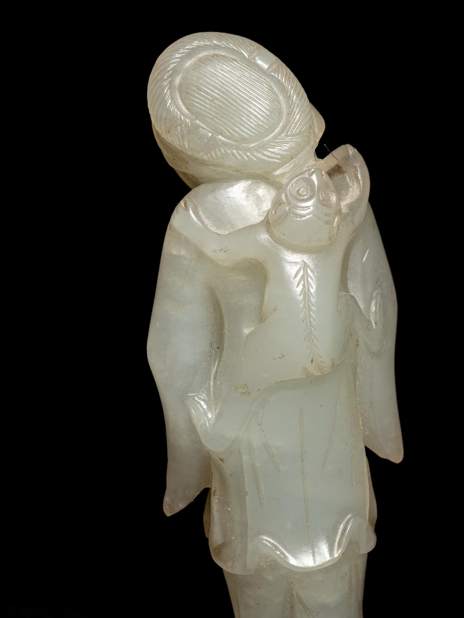 Two Carved Pale Celadon Jade Figures