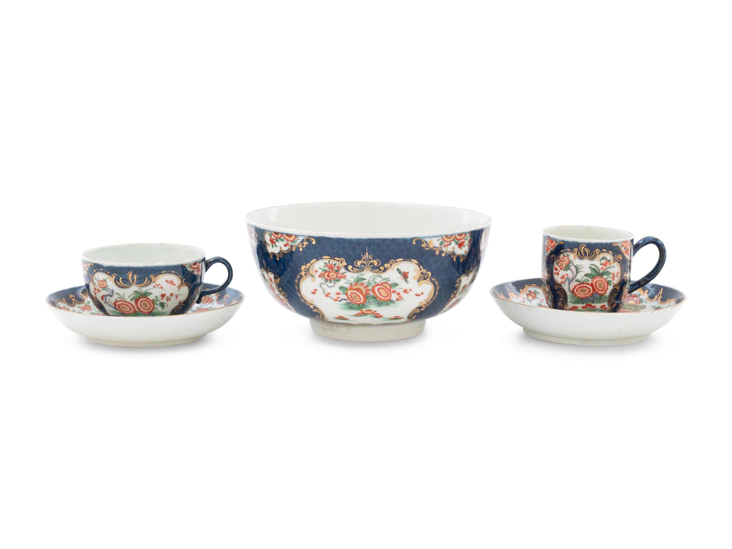A Royal Worcester Painted and Parcel Gilt Porcelain Tea and Coffee Service