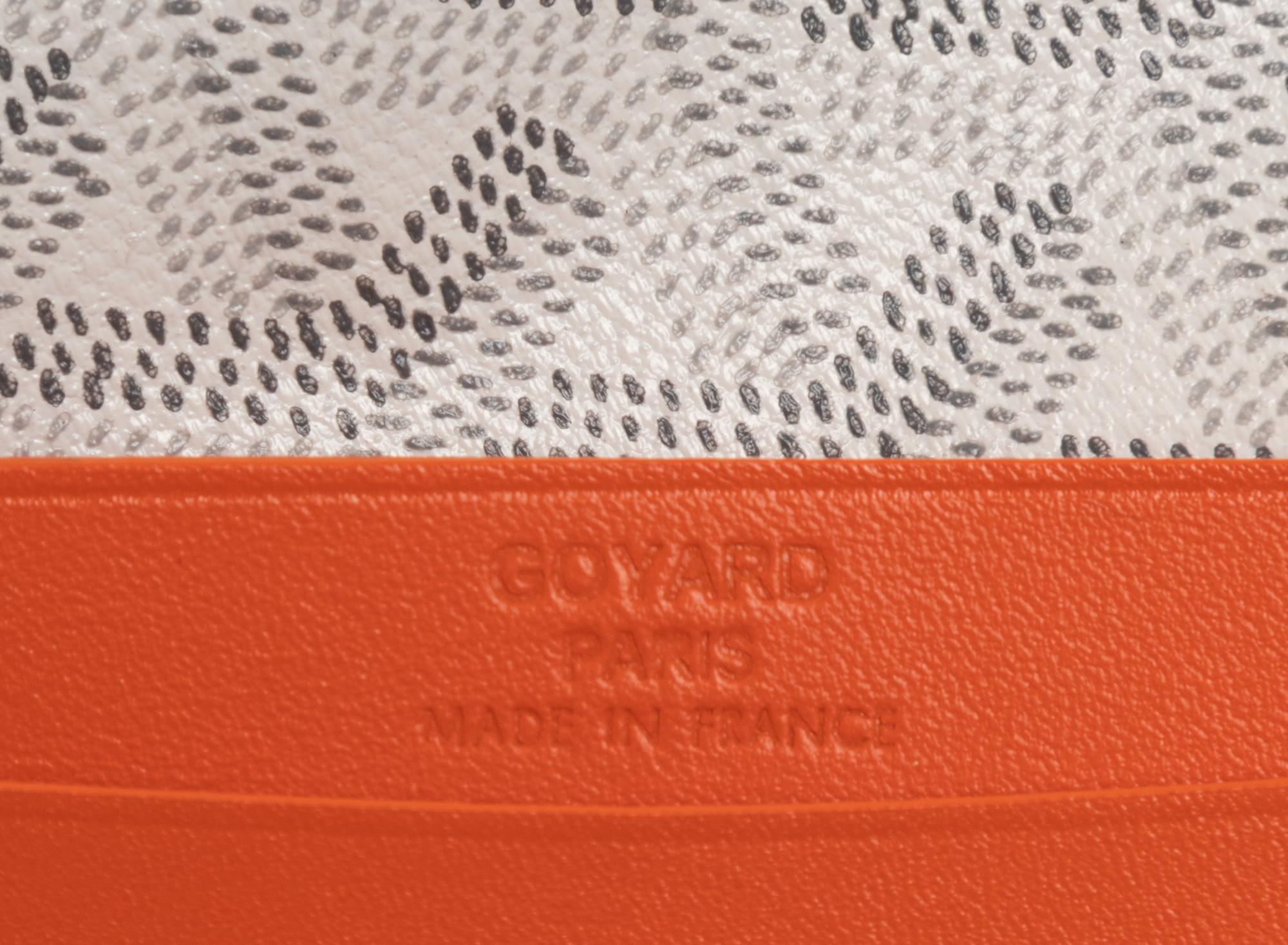 Six Goyard Items: Two Totes, Three Pouches, and One Wallet