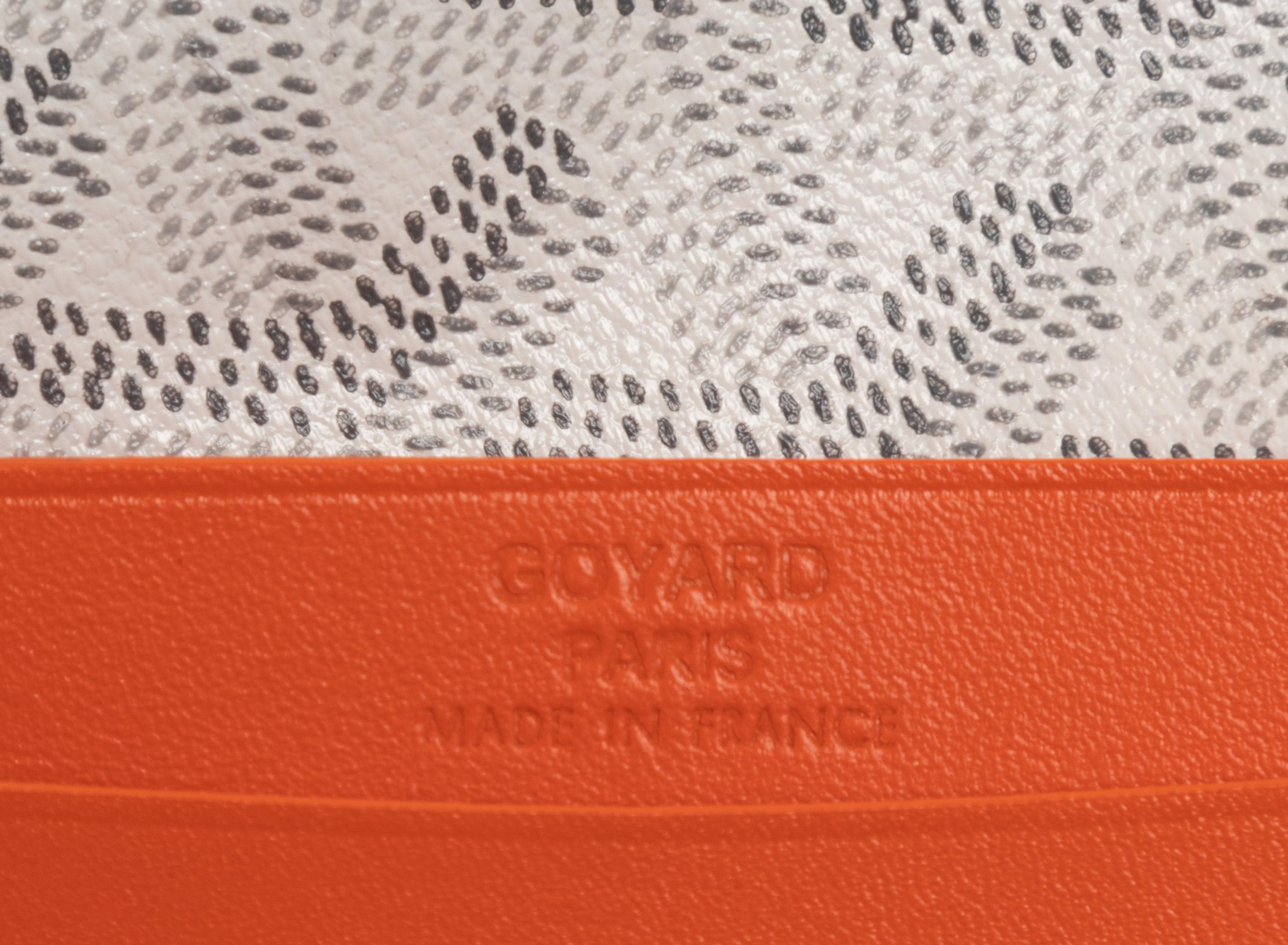 Six Goyard Items: Two Totes, Three Pouches, and One Wallet
