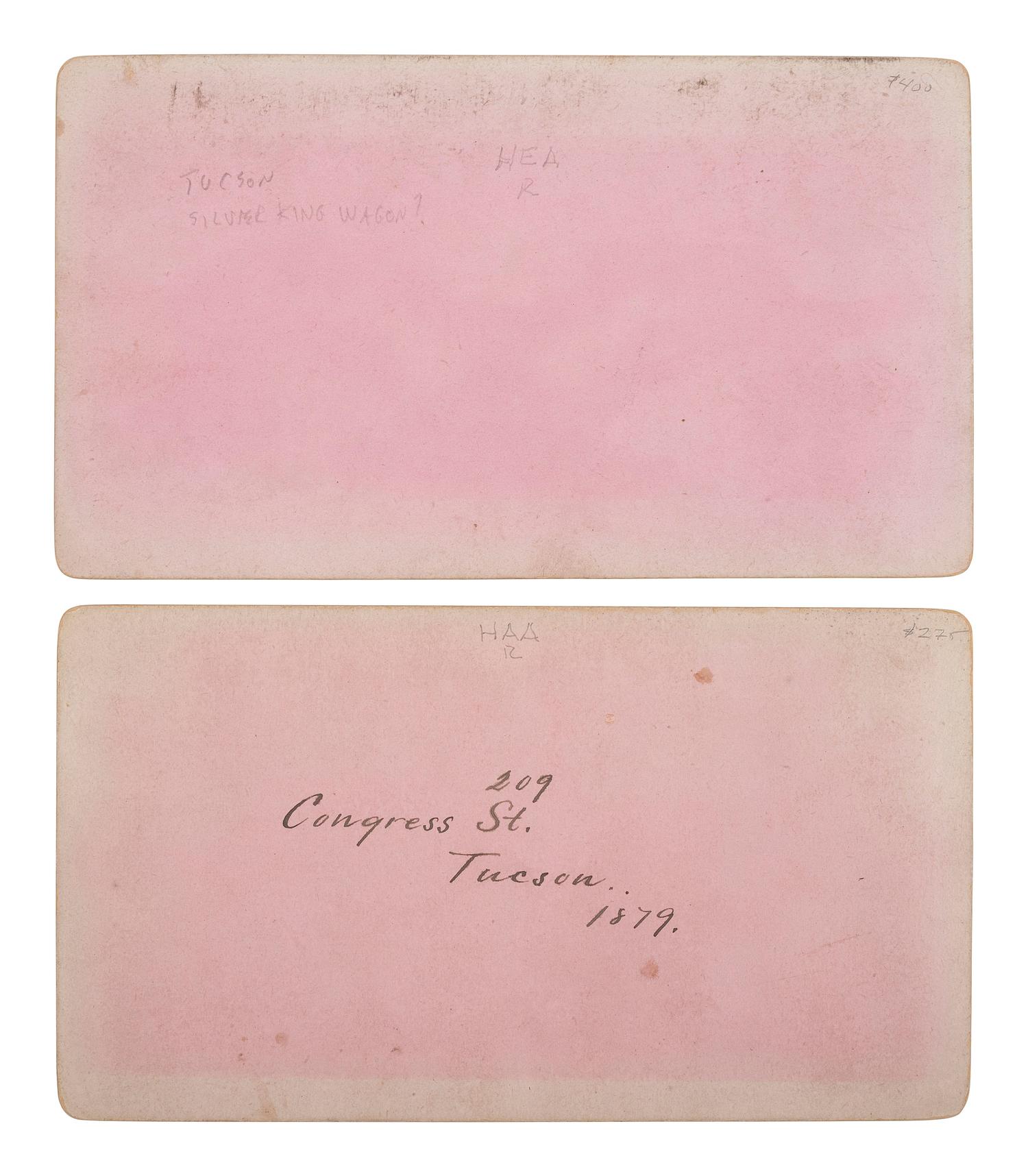 [WESTERN AMERICANA - ARIZONA]. BUEHMAN, Henry (1851-1912), photographer. A group of 2 stereoviews of Tucson, incl. view of Congress Street and horse-drawn ore cart passing through town. Tucson, Arizona Territory, ca 1870s.